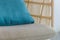 Close up modern wicker chair with cushion and comfort pillow in room. Near by the window