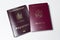 Close-up of Moldavian and Romanian passports isolated on white background.