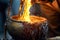 close-up of molten metal pouring from a crucible