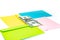 Close up of money in pink envelope are lying on the Multi colored envelopes and letters as a background.  Branding mock up; differ