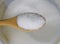 Close up of mono sodium glutamate on wooden spoon