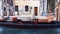 Close up of moored empty gondola on a Venice canal