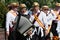 Close up of morris man playing an accordion or squeezebox