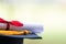 Close-up of a mortarboard and degree certificate put on table. Education stock photo