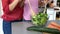 Close up on mother and daughter cooking a salad