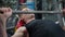 Close-up of motivated handsome sportsman lifting barbell exhaling lying on exercise bench in gym. Confident concentrated