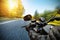 Close-up of motorbiker riding on empty road