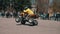 Close-up of a motorcyclist on an ATV. He makes a sharp turn in front of the crowd at the motor show.