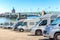 Close up motorhomes parked in a row on background The Saint-Pierre bridge passes over the Garonne river in Toulouse, France