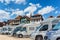 Close up motorhomes parked in a row on background traditional colorful houses in La Petite France, Strasbourg, Alsace, France