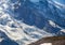 Close-up of Mount Rainier glaciers with two tiny people