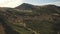 Close up mountain rock top aerial. Green grass, moss at hills, peak. Autumn nobody nature landscape