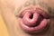 Close up mouth of man fold his tongue