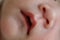 Close up mouth and nose newborn baby sensitive skin