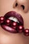 Close up mouth with red pearls and lipstick