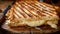 Close up of mouthwatering grilled cheese sandwich on a rustic wooden serving board