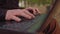 Close-up Moving Macro Shot: Person Typing on the Computer Keyboard. Working, Writing Emails, Using Internet. Notebook