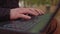 Close-up Moving Macro Shot: Person Typing on the Computer Keyboard. Working, Writing Emails, Using Internet. Notebook