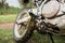 Close-up of muddy rear wheel of dirt bike, details.