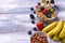 Close-up Muesli, nuts, fruits, berries, banana on wooden rustic background. Healthy food concept