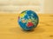 Close Up Multi Color Mini Globe with Wooden Table Background