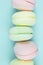 Close up Multi Colored Stacked Up marshmallow looks like French Macarons on Blue