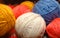 Close up on multi-coloured balls of wool