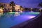 Close-up of multicolored  illuminated swimming pool  at  hotel resort  during   night