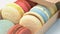 Close-up multicolored macarons from natural ingredients and colors go out of box