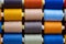 Close-up of multicolored sewing thread spools