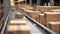 Close-up of multiple cardboard box packages moving along a conveyor belt in a warehouse