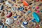 Close up of multiple climbing wall holds, grips and footholds of various colours, shapes and sizes.