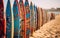 Close up of multiple colorful surf boards lined up on the beach sand on a sunny day