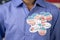 Close up of multiple I Voted stickers on blue shirt - Concept of US election voter fraud by placing multiple voting