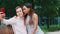 Close-up of multiracial girl and boy in love hugging and taking selfie