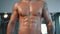 Close up muscular male sport body in gym