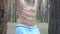 Close up muscular torso of athletic man doing abdominal exercises on horizontal bar. Sportive guy working out at forest