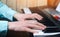 Close-up of a music performer`s hand playing the piano, man`s hand, classical music, keyboard, synthesizer, pianist