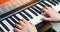 Close-up of a music performer`s hand playing the piano, man`s hand, classical music, keyboard, synthesizer, pianist