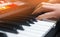 Close-up of a music performer`s hand playing the piano, man`s hand, classical music, keyboard, synthesizer, pianist