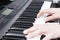 Close-up of a music performer`s hand playing the piano, man`s hand, classical music, keyboard, synthesizer, pianist.