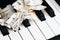 Close-up music score on piano keyboard, piece of paper