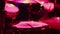 a close-up of a musician actively playing drums and hi-hat, illuminated by pink-red light. The concept of a rehearsal, a