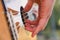 Close-up of the musician\'s playing hands. The guitarist plays the guitar.