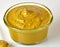 Close up of mustard in bowl on white background created using generative ai technology