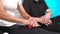 Close-up Myofascial release. A male physiotherapist places a ball for the rehabilitation of the client's leg muscles