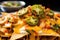 close-up of nachos topped with melted cheese and jalapenos