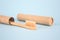 Close up of natural bamboo toothbrushe packed in reusable paper tube on blue background with copy space. Sustainable lifestyle and
