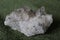 Close-up of natural unprocessed rock crystal on a green background