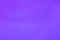close up of neon bright blue purple semi smooth stucco wall texture background